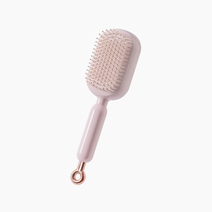 Adjustable length self-cleaning massage comb
